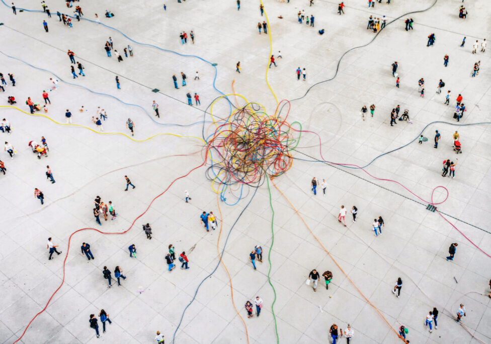 Aerial view of crowd connected by colouful lines
