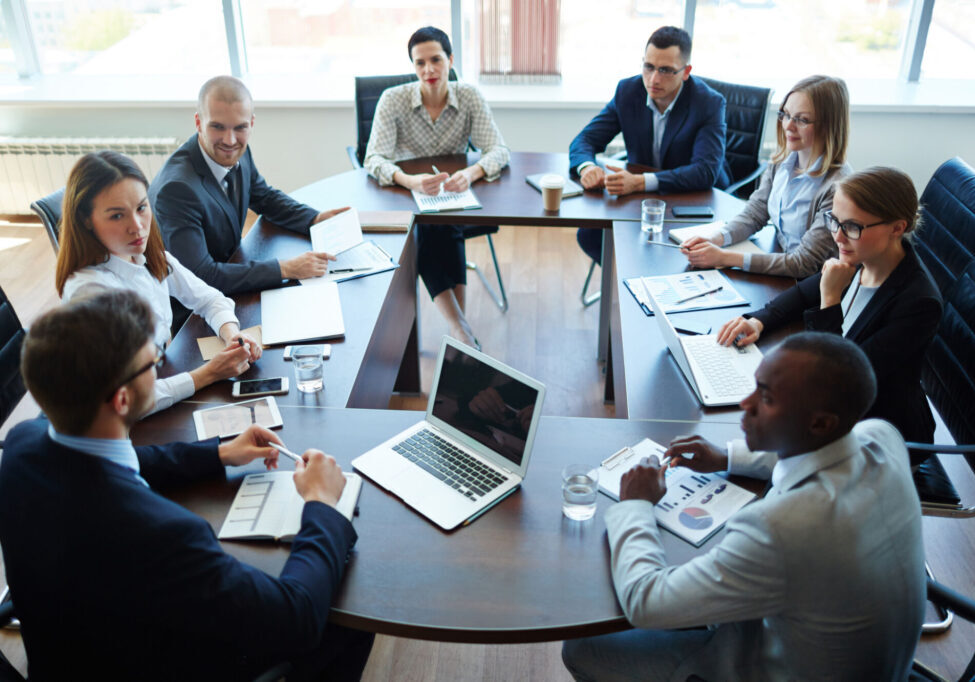 Businespeople at panel discussion in board room